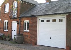 Sectional garage door in Stevenage, Hertfordshire with plain windows